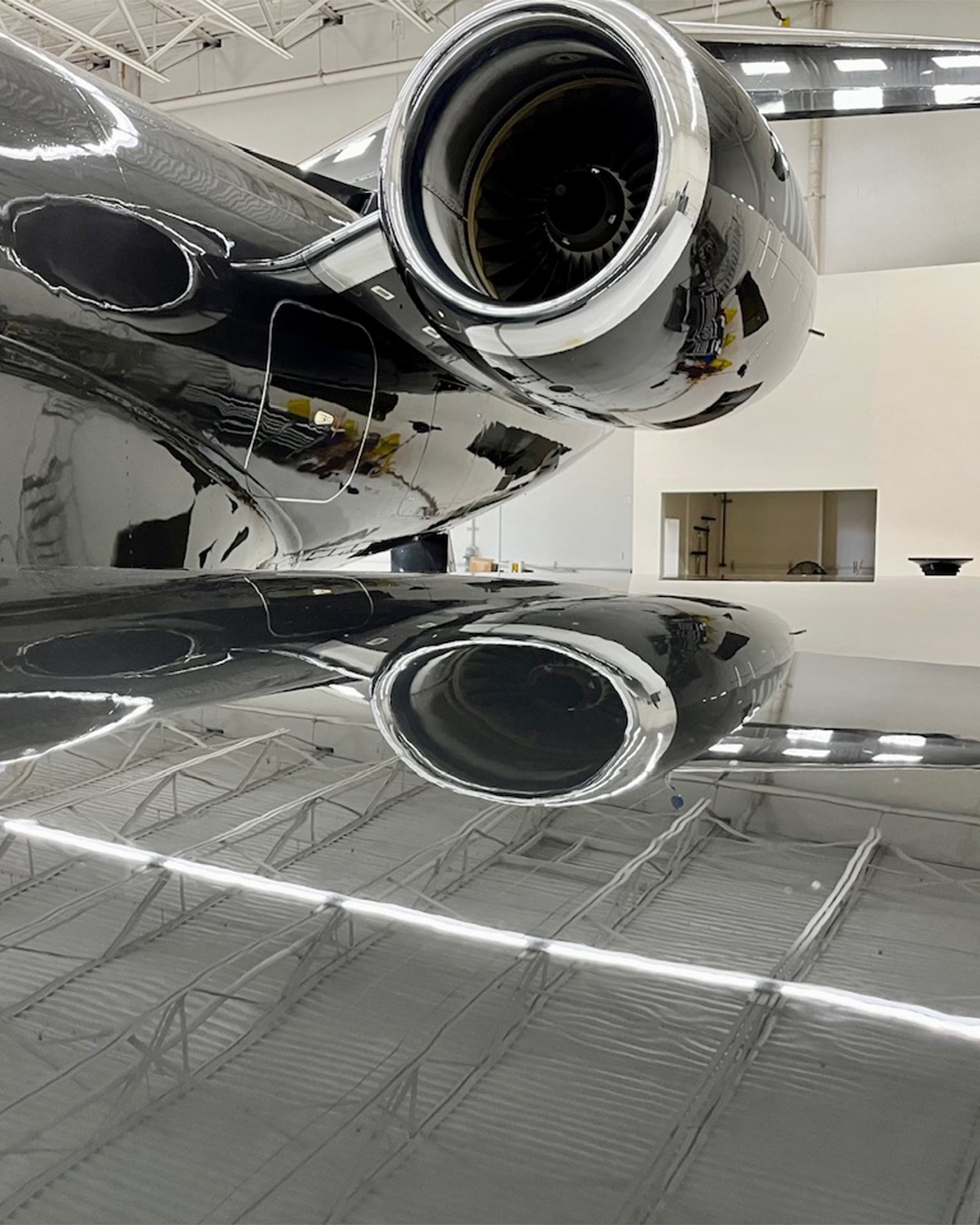Polished aircraft engines and protected composite surfaces in a hangar